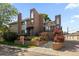 Beautiful brick townhome with a well-maintained front yard and professional signage at 221 S Garfield St # 213, Denver, CO 80209
