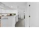 Modern kitchen featuring sleek white cabinets, neutral paint, and updated backsplash at 221 S Garfield St # 213, Denver, CO 80209
