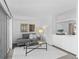 Cozy living room featuring a sliding glass door, comfortable seating, and modern decor at 221 S Garfield St # 213, Denver, CO 80209