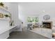 Bright living room with bay window, cozy fireplace, neutral decor, and plush rug at 221 S Garfield St # 213, Denver, CO 80209