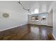 Living room with dark hardwood floors and a window at 1341 Sharpe Pl, Longmont, CO 80501