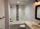 Elegant bathroom with a tub, shower, marble tile, and a quartz vanity at 270 High Meadows Loop, Elizabeth, CO 80107