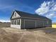 Detached two-car garage with matching gray siding and stone accents complementing the main home at 270 High Meadows Loop, Elizabeth, CO 80107