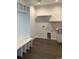 Mudroom with white bench, shelving, and utility sink at 270 High Meadows Loop, Elizabeth, CO 80107