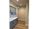 Charming mudroom features grey cabinets, white marble counters, and wood-look vinyl floors at 270 High Meadows Loop, Elizabeth, CO 80107