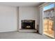 Gas fireplace with stone surround in living room at 3855 S Monaco St # 167, Denver, CO 80237