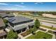Aerial view of home with beautiful lawn, landscaping and view of community amenities at 11033 E 28Th Pl, Denver, CO 80238