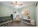 Adorable Bedroom featuring stylish decor, soft lighting, and comfortable seating at 11033 E 28Th Pl, Denver, CO 80238