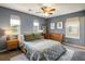 Comfortable bedroom featuring stylish decor, natural light, and modern furnishings at 11033 E 28Th Pl, Denver, CO 80238
