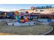 Inviting public plaza featuring colorful art installations, seating, and storefronts for community engagement at 11033 E 28Th Pl, Denver, CO 80238