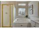 Relaxing bathroom with soaking tub and updated gold fixtures at 2903 S Walden Way, Aurora, CO 80013