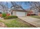 Two-story house with attached garage and landscaped yard at 2903 S Walden Way, Aurora, CO 80013