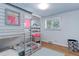 Charming bedroom features a custom-built bunk bed with a playful design and natural light from a window at 3090 S High St, Denver, CO 80210