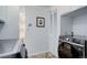 Functional laundry area with modern washer and dryer appliances, built-in storage, and efficient layout at 3090 S High St, Denver, CO 80210