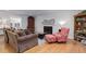 Inviting living room with a cozy fireplace and a comfortable seating area at 3090 S High St, Denver, CO 80210