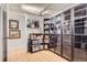 Bedroom with a closet, television, and glass shelving at 800 N Pearl St # 206, Denver, CO 80203
