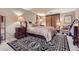 Comfortable bedroom with a large bed, two nightstands with lamps, and carpet with a bold design at 800 N Pearl St # 206, Denver, CO 80203