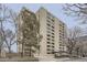 View of a modern high-rise apartment building featuring multiple balconies, landscaping, and street access at 800 N Pearl St # 206, Denver, CO 80203