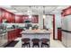 Efficient kitchen layout with stainless steel appliances and a breakfast bar island, and connecting dining space at 800 N Pearl St # 206, Denver, CO 80203