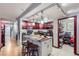 Bright kitchen with an island, stainless steel appliances, and a pantry, seamlessly connecting to the living area at 800 N Pearl St # 206, Denver, CO 80203