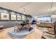 Open-concept living area with dining space, hardwood floors, and a comfortable seating arrangement at 800 N Pearl St # 206, Denver, CO 80203