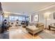 Bright and airy living room featuring hardwood floors, a comfortable sectional, and ample natural light at 800 N Pearl St # 206, Denver, CO 80203