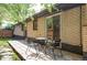 Quaint backyard patio with table and chairs, perfect for relaxing outside on a sunny day at 1695 E Eastman Ave, Englewood, CO 80113