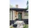 Inviting front entrance with a green door, modern fixtures, and a well-maintained brick facade at 1695 E Eastman Ave, Englewood, CO 80113