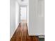 Hallway with hardwood floors leading to other rooms at 1695 E Eastman Ave, Englewood, CO 80113