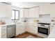 Well-equipped kitchen boasting stainless steel appliances, ample counter space, and sleek cabinetry at 1695 E Eastman Ave, Englewood, CO 80113