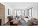 Bright and airy living room with a large window, modern decor, and a cozy atmosphere at 1695 E Eastman Ave, Englewood, CO 80113