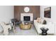 Cozy living room with wood paneled fireplace and modern furnishings at 1695 E Eastman Ave, Englewood, CO 80113