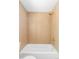 Contemporary shower featuring wood-look tile walls, sleek fixtures, and a relaxing atmosphere at 1695 E Eastman Ave, Englewood, CO 80113