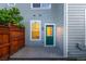 Charming backyard with brick pavers, a privacy fence and a door leading inside the home at 8421 E 29Th Ave, Denver, CO 80238