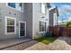 Property showcases a private patio, fenced yard and synthetic grass for easy maintenance at 8421 E 29Th Ave, Denver, CO 80238
