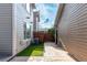 This home features a small patio area, fenced yard, and synthetic grass for simplified upkeep at 8421 E 29Th Ave, Denver, CO 80238