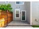Enclosed backyard has a wooden privacy fence, brick pavers and an access door to the home at 8421 E 29Th Ave, Denver, CO 80238