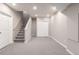 Finished basement with stairs, closet, carpet flooring, and recessed lighting at 8421 E 29Th Ave, Denver, CO 80238