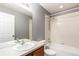 Classic bathroom with vanity, sink, toilet, and shower-tub combination with white tiling at 8421 E 29Th Ave, Denver, CO 80238
