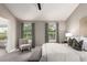 Bedroom with carpet flooring, ceiling fan, and decoratively patterned curtains at 8421 E 29Th Ave, Denver, CO 80238