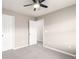 Neutral bedroom with carpet, ceiling fan, and a doorway into another room at 8421 E 29Th Ave, Denver, CO 80238