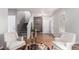 A cozy living room featuring hardwood floors, neutral walls, and comfortable seating at 8421 E 29Th Ave, Denver, CO 80238