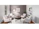 Living room featuring hardwood floors, neutral walls, and comfortable seating at 8421 E 29Th Ave, Denver, CO 80238