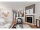 Cozy living area with hardwood floors, fireplace, and stylish decor at 8421 E 29Th Ave, Denver, CO 80238