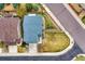 Birds-eye view of a home with manicured lawn, verdant landscaping, and neat edging along neighborhood street at 4808 S Picadilly Ct, Aurora, CO 80015