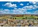Aerial view of a suburban neighborhood near a school with athletic fields and facilities at 4808 S Picadilly Ct, Aurora, CO 80015