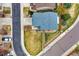 Overhead view of a home with a well-maintained lawn, manicured landscaping, and paved drive near a street at 4808 S Picadilly Ct, Aurora, CO 80015