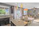 Bright kitchen view featuring granite countertops, stainless appliances, and an open layout to the living area at 4808 S Picadilly Ct, Aurora, CO 80015