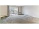 Unfurnished Living Room features sliding glass door to outside balcony at 9385 E Center Ave # 6A, Denver, CO 80247