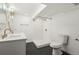 Basement bathroom with a walk-in shower, double vanity, and hexagon tile floor at 2640 York St, Denver, CO 80205